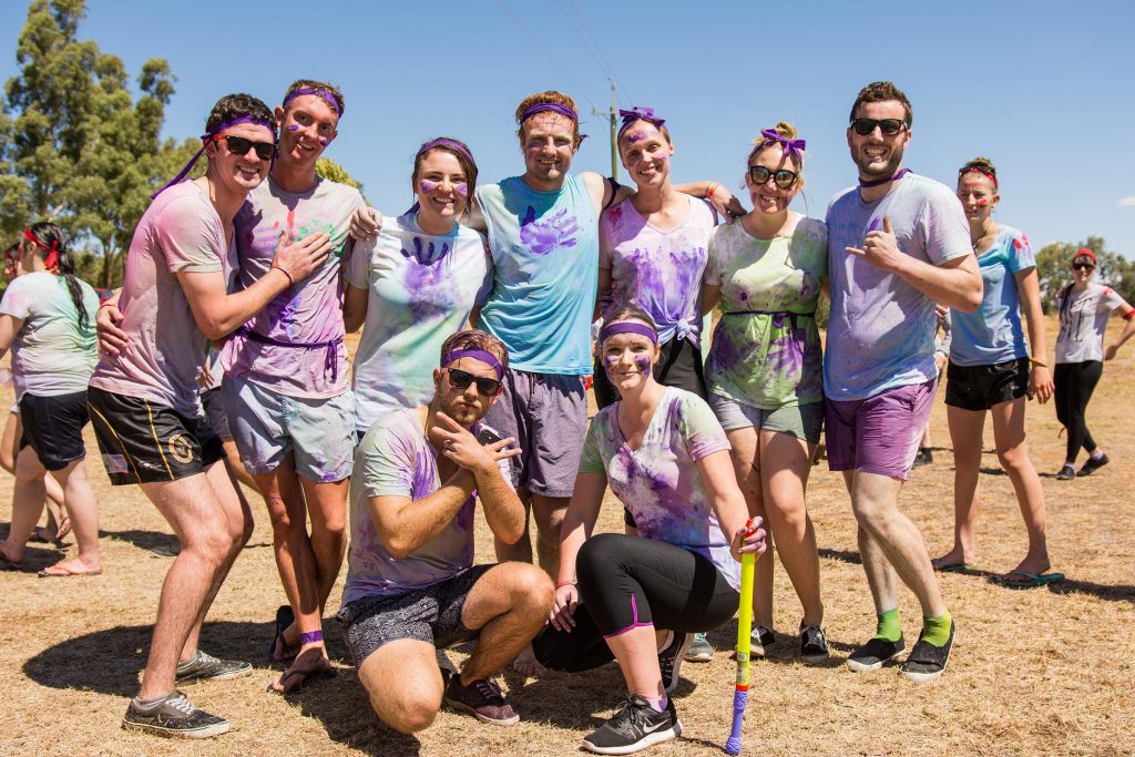 Group of university students covered in paint