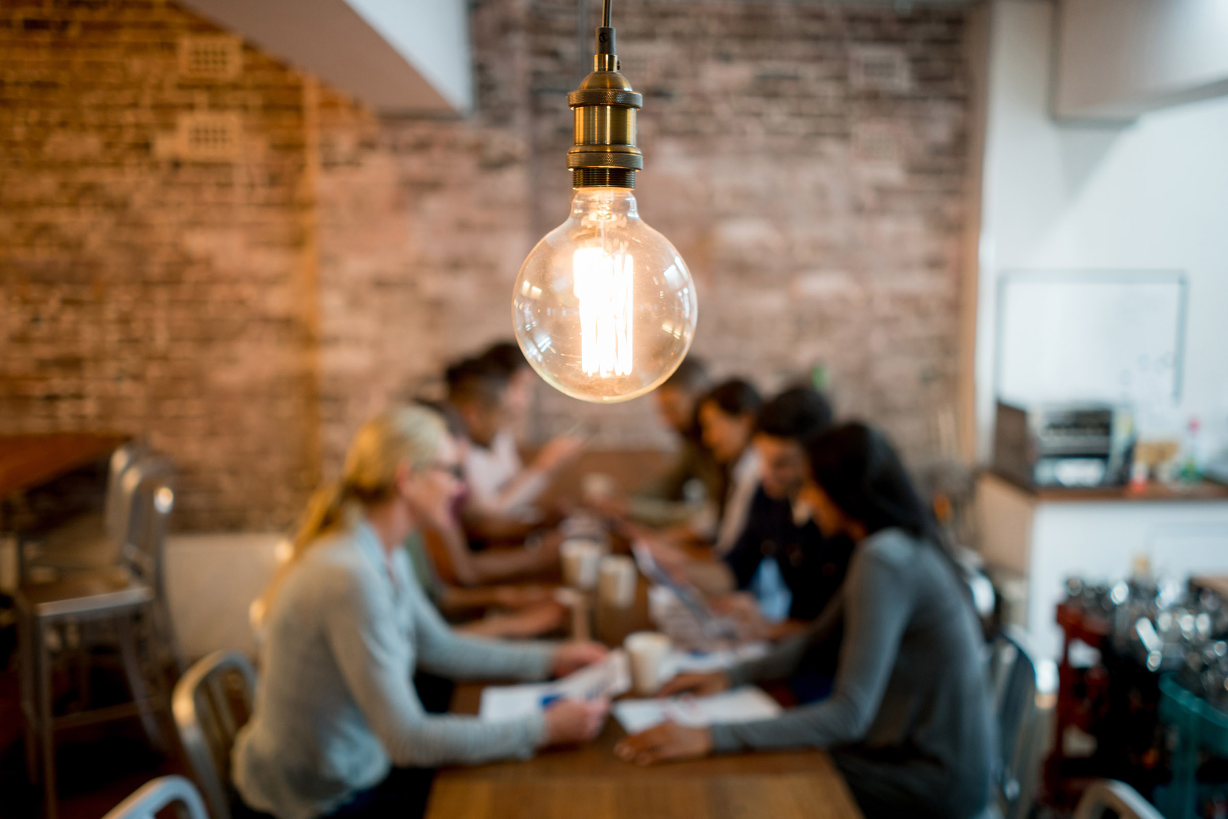 People at a table discussing business ideas