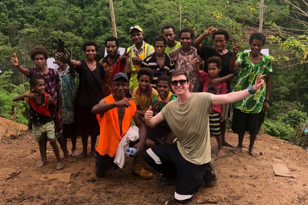 Charles Sturt student Dylan Male pictured with a group of Papua New Guineans.