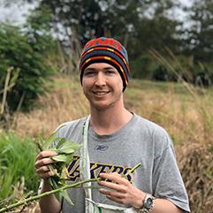 Charles Sturt student Dylan Male pictured on location in a Papua New Guinea field.