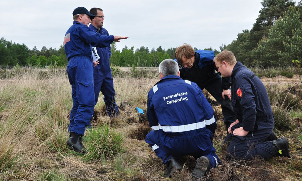 Wildfire experts inspecting a field