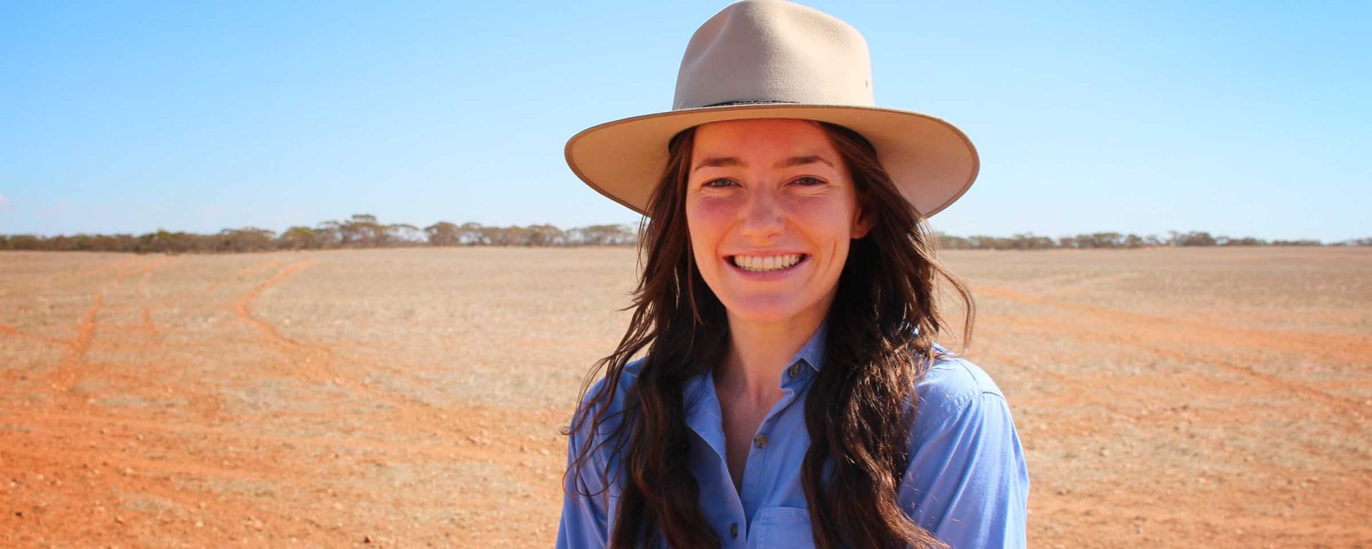 Demi Taylor in a rural setting. Demi is the recipient of an agriculture scholarship from Charles Sturt University