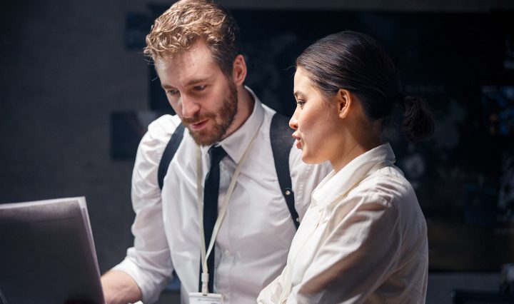 A woman and a man at a computer discussing a carer in law