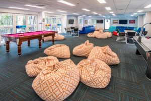 A collection of bean bags and a pool table