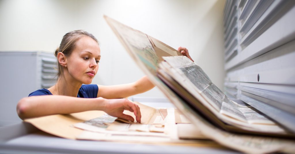 woman looking at archives