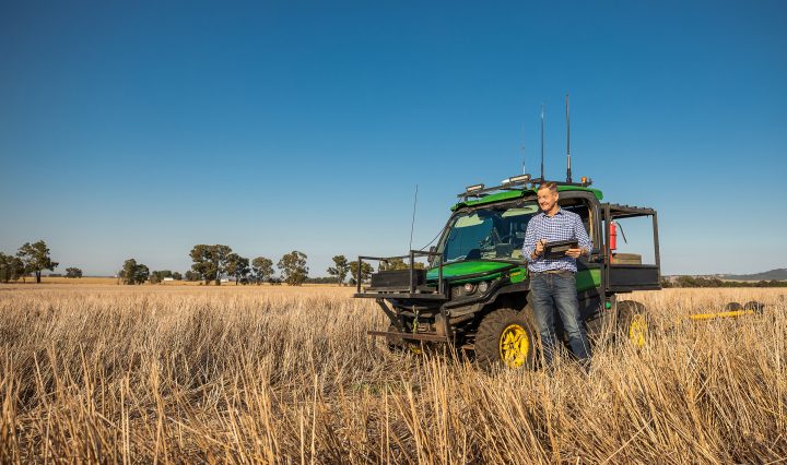 Combine harvetser in an arable field on the global digital farm