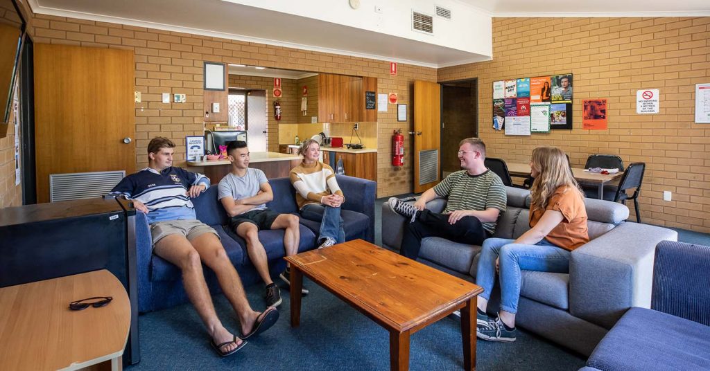 A group of uni students hanging out at their on-campus accomodation