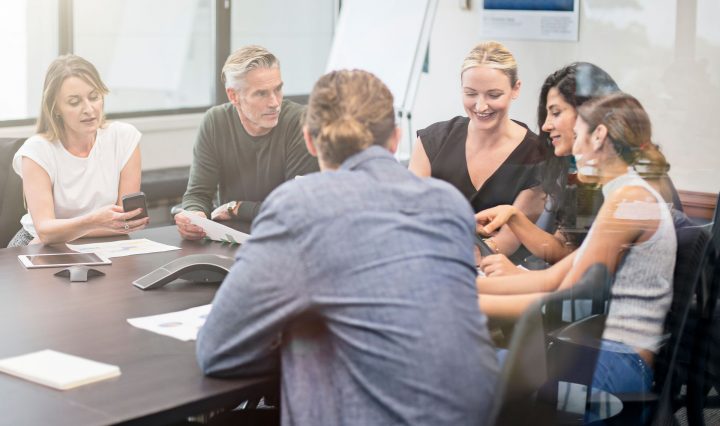 Group of people sat at a table discussing emerging careers