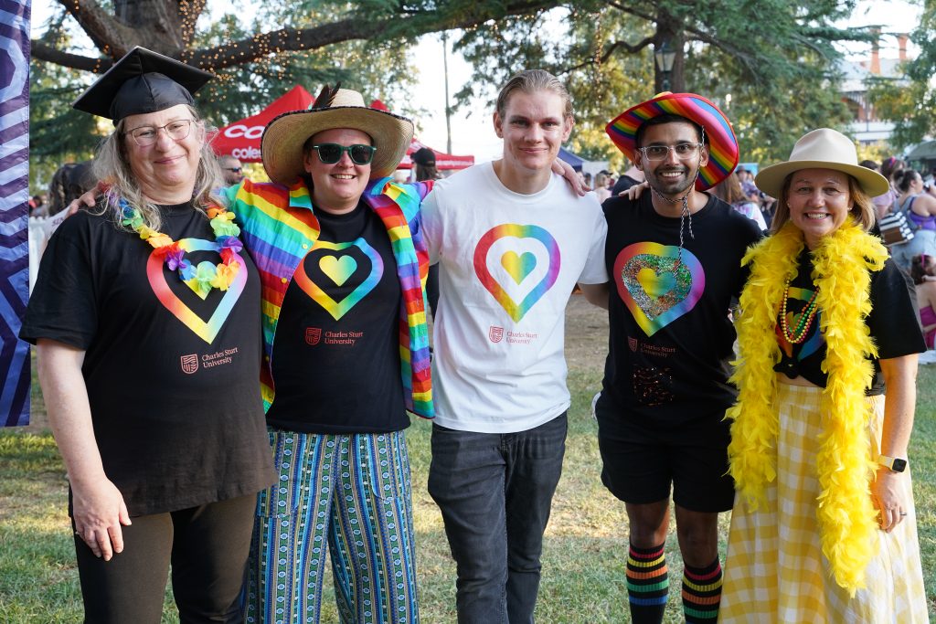 Five people dressed in colourful shirts at the Wagga Wagga Mardi Gras