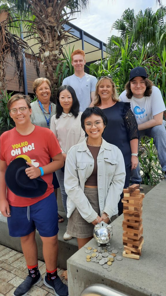 Team of accounting students with jenga