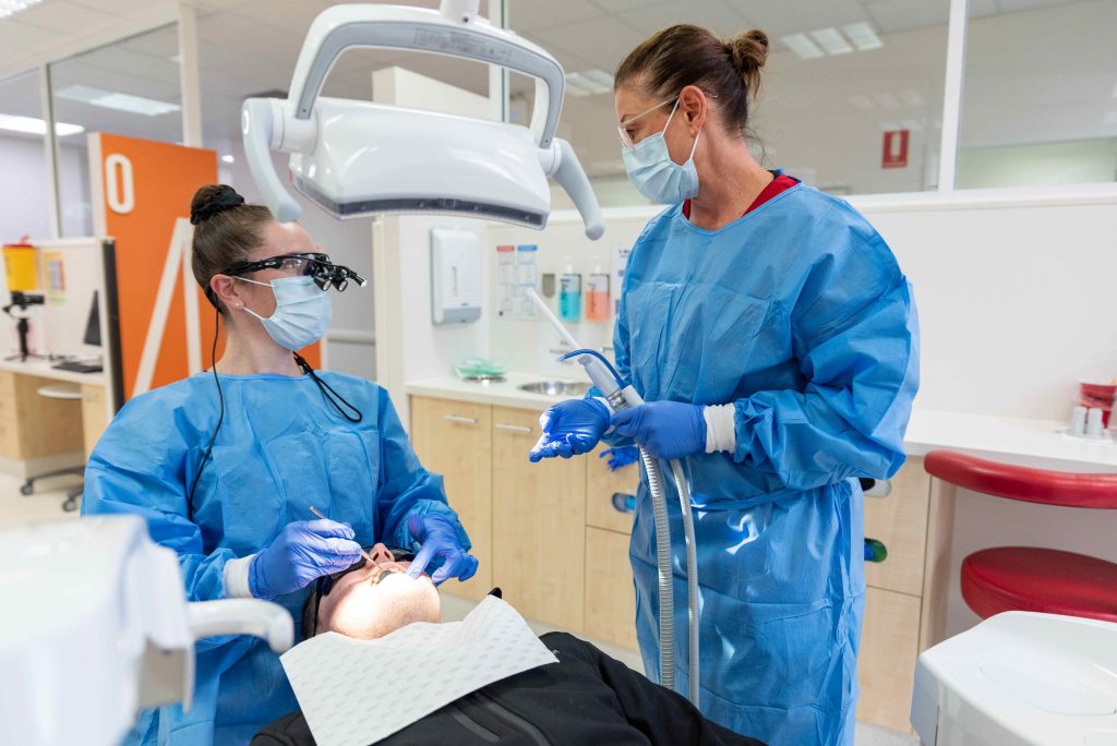 Charles Sturt dentistry students learning hands-on.