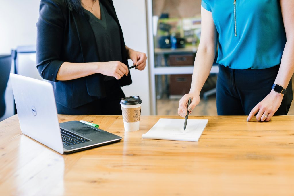 An accountant pointing at paperwork