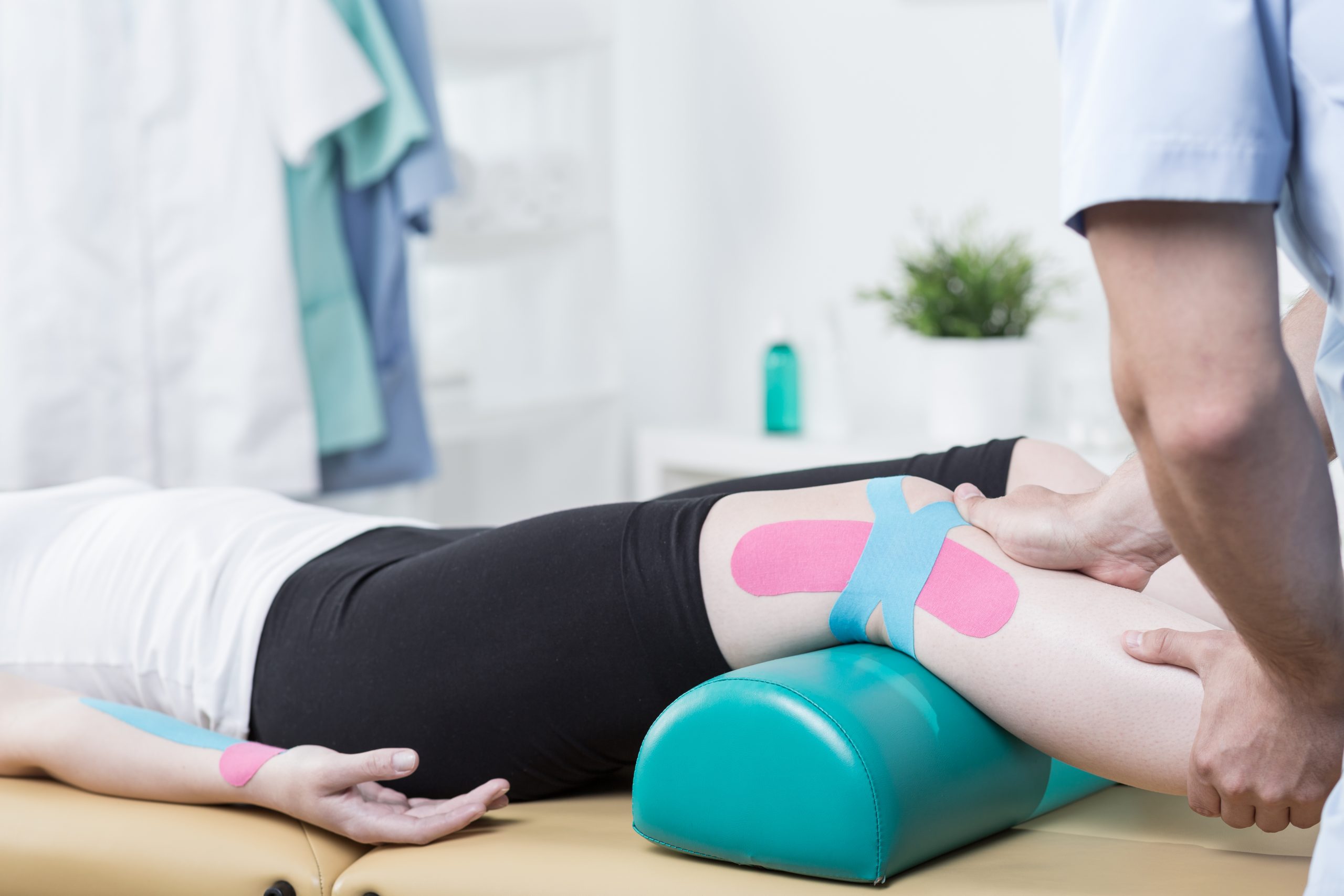 Approved image for Bachelor of Physiotherapy 2017 Photo of patient with elastic therapeutic tape during exercises Patient with elastic therapeutic tape patient, exercises, kinesio, tape, taping, kinesiotaping, elastic, therapeutic, physiotherapy, physiotherapist, work, health, therapist, medicine, leg, treatment, healthcare, specialist, therapy, doctor, isolated, clinic, working, legs, alternative, medical, examine, physical, hospital, healthy, occupation, rehabilitation, professional, condition, exercise, room, disorder, profession, equipment, male, man, woman, caucasian, close up, photo