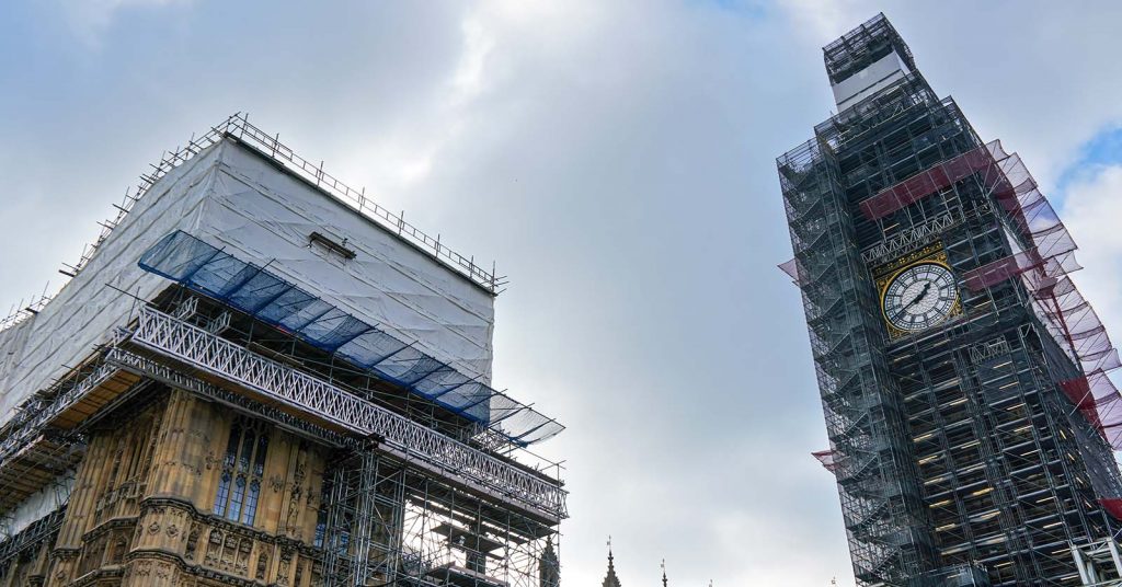 Two old building covered in scaffolding