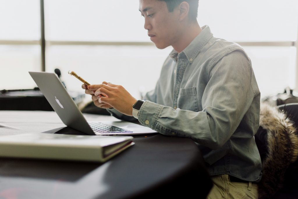 An man in accounting working at a computer