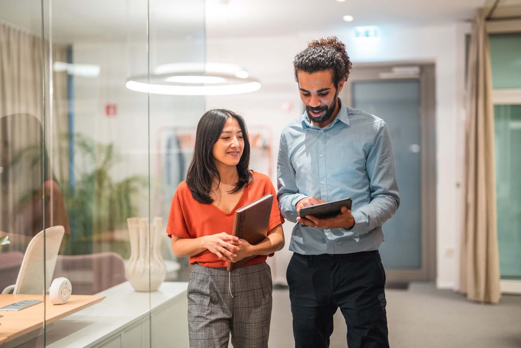 Woman and man looking at tablet