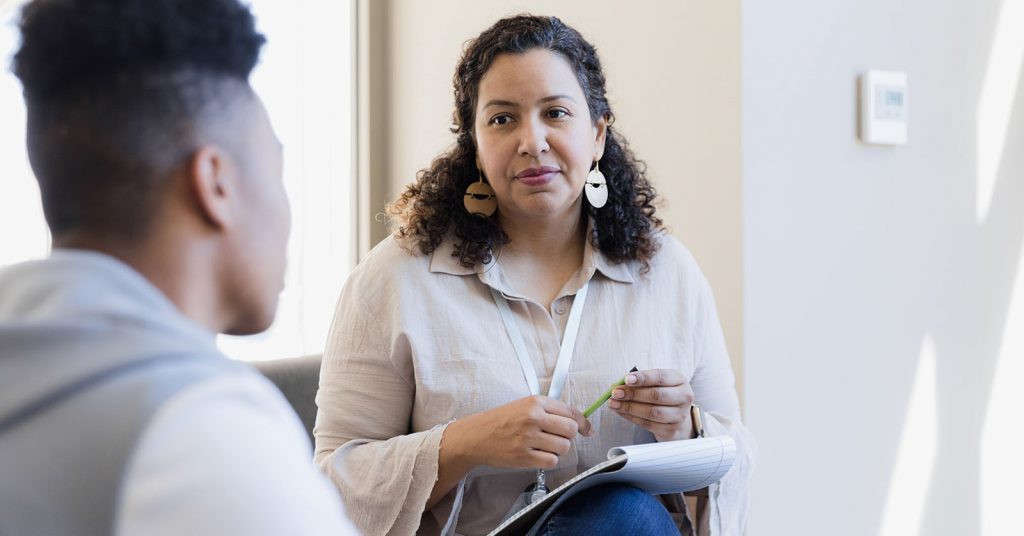 Female counsellor with male client