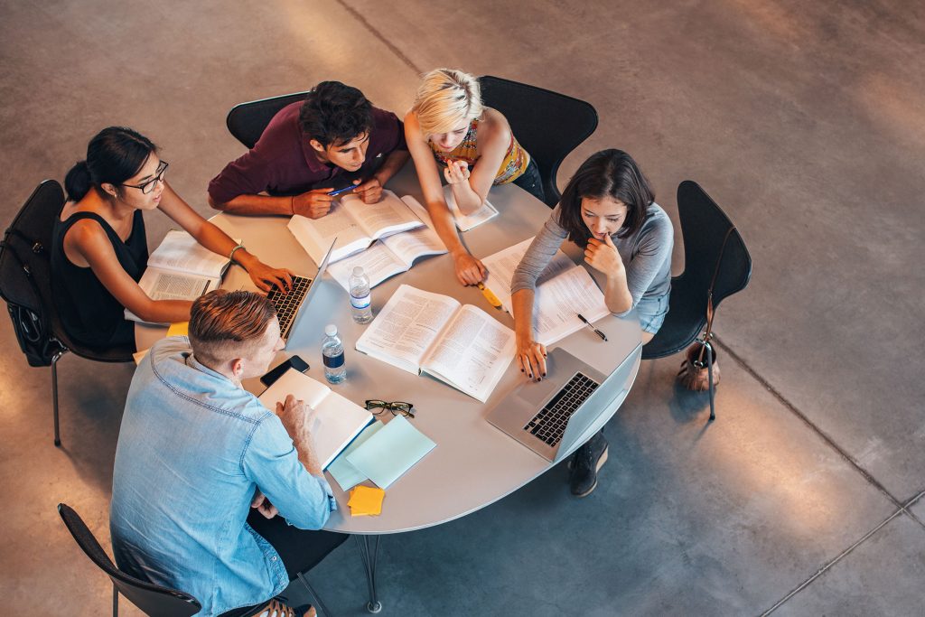 Group of university students around a table