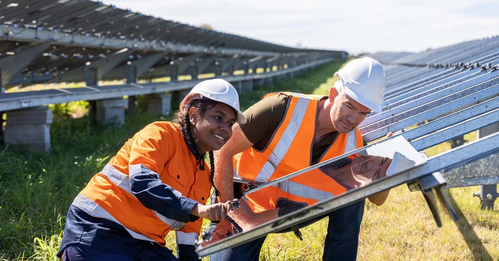 Technicians installing solar panels