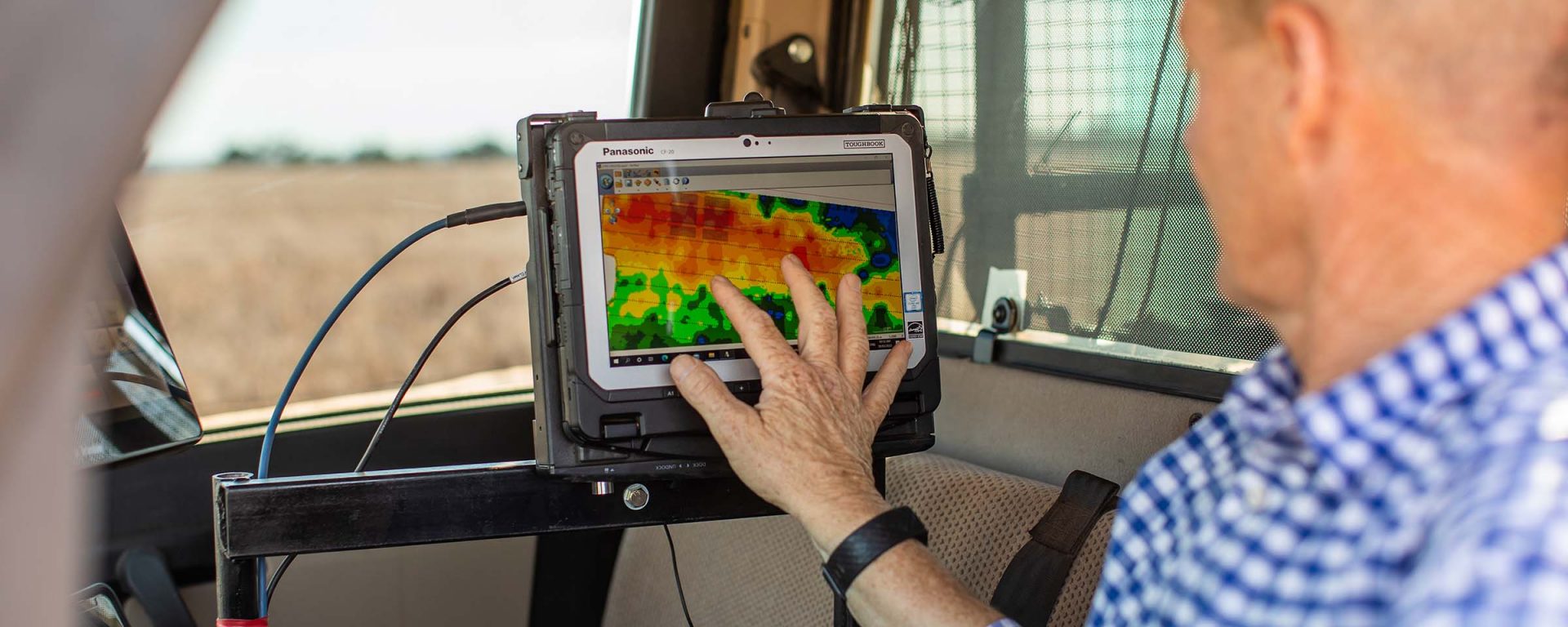 Man using technology on a farm