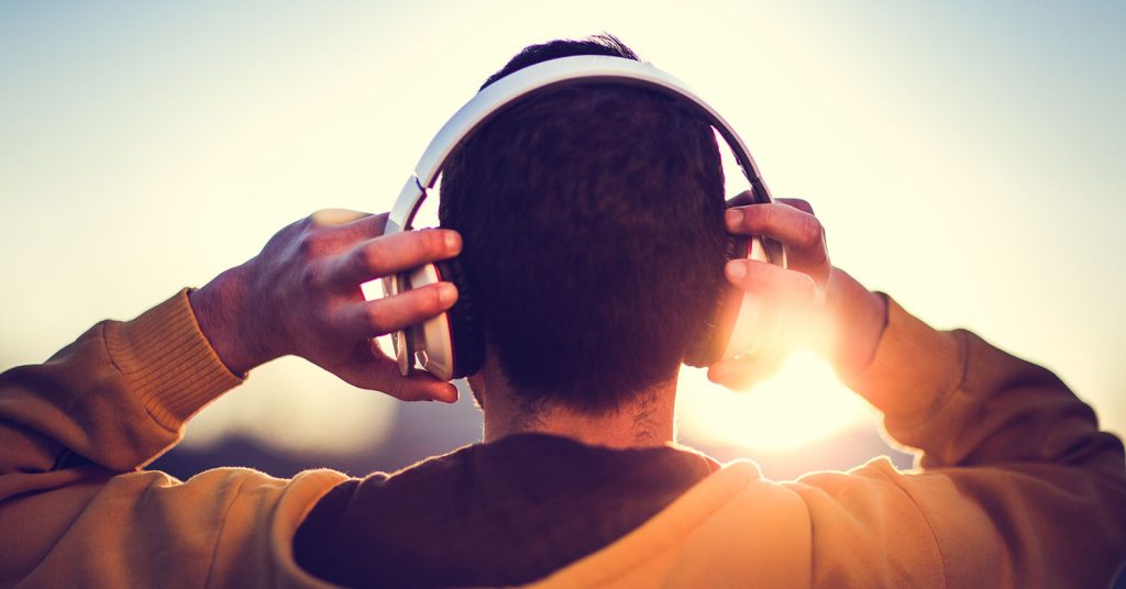 Man with headphones. Relaxation is one of the top mental health tips for university students