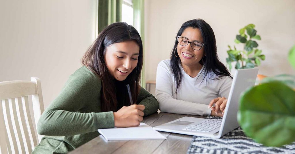 mother and daughter at laptop