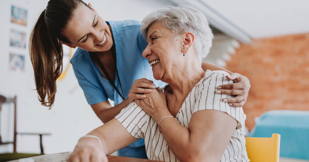 Social worker helping an elderly person