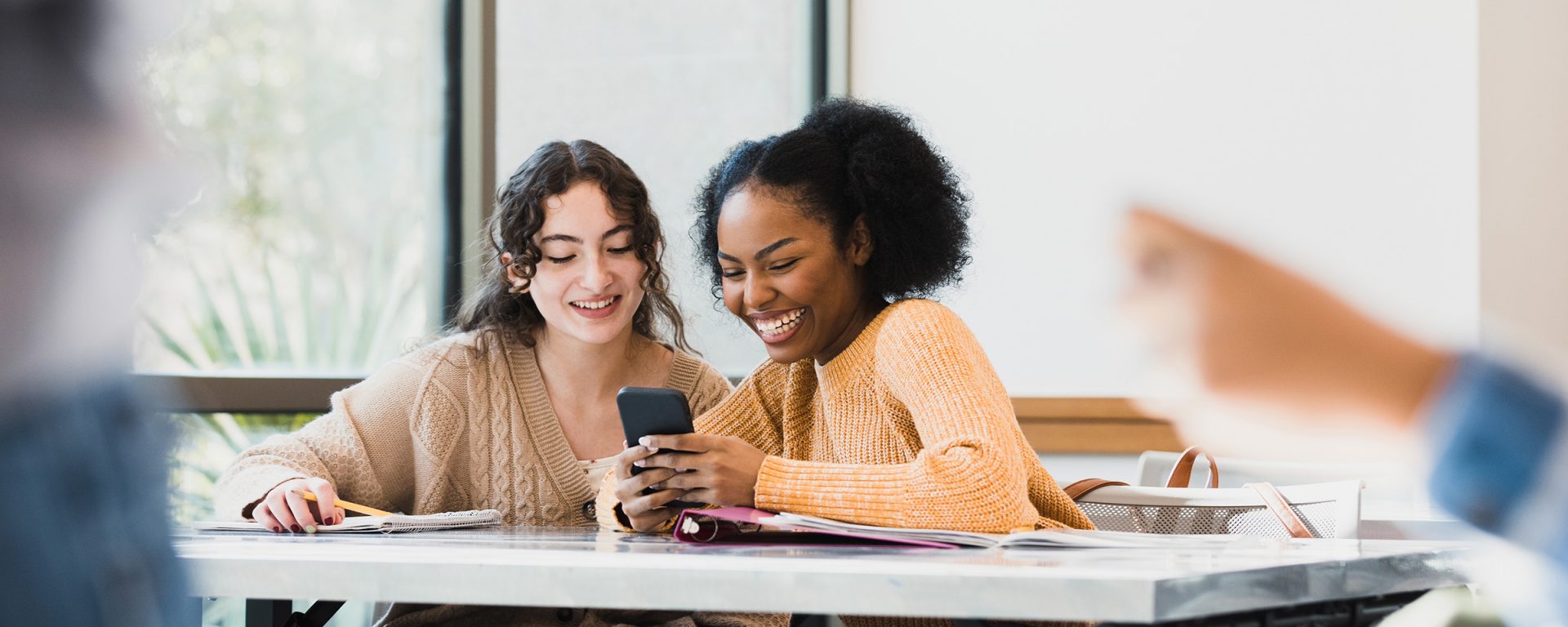 students looking at phone