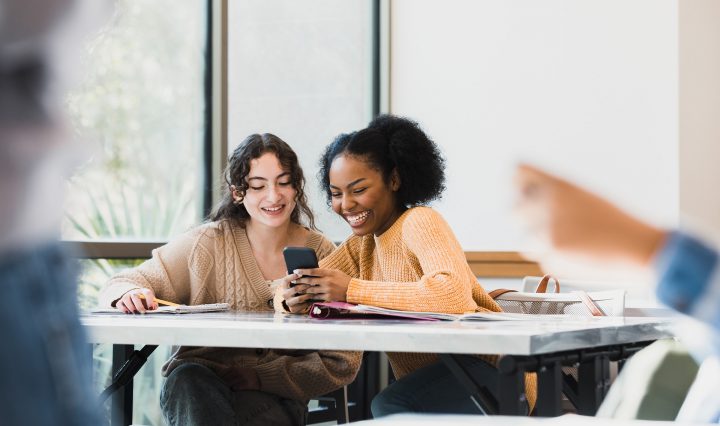 students looking at phone
