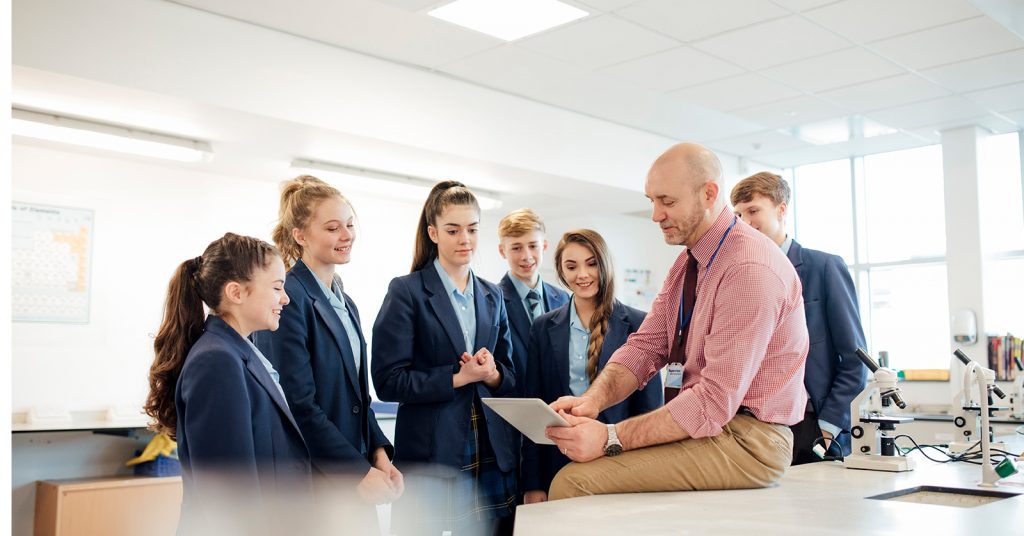 Teacher with students in a classroom