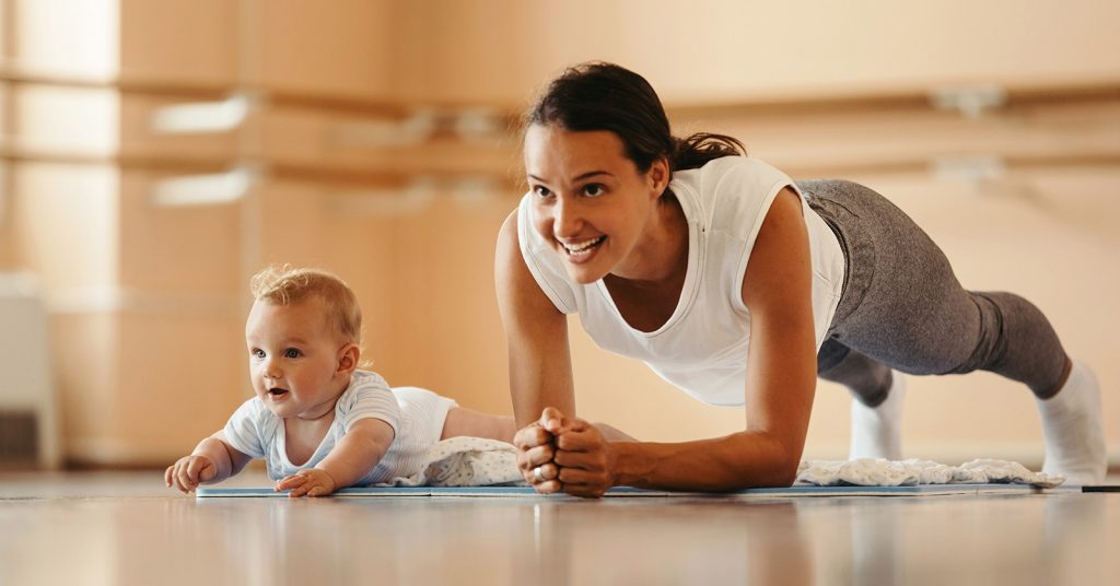 Mother and baby on mat