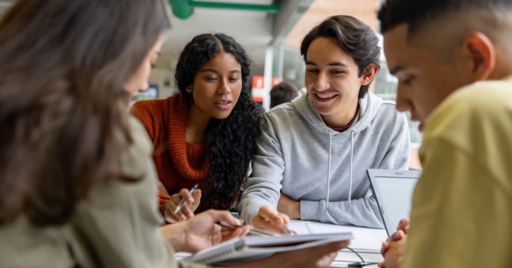 Students studying around a table