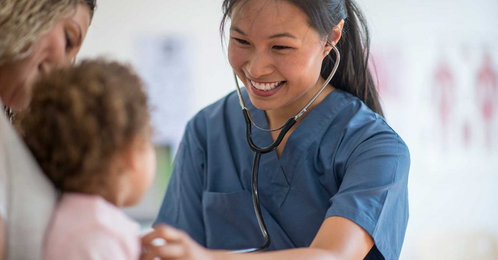 health clinician treating a child