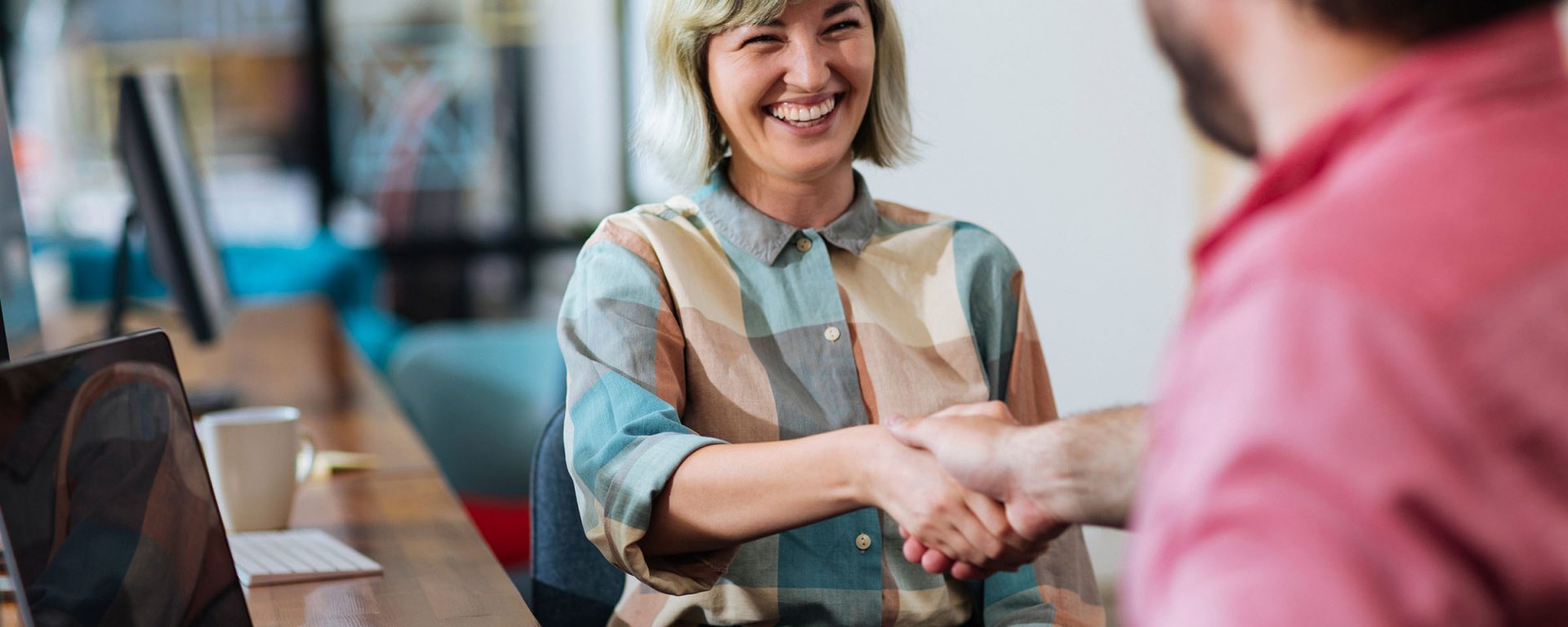 Woman shaking hands with a colleague