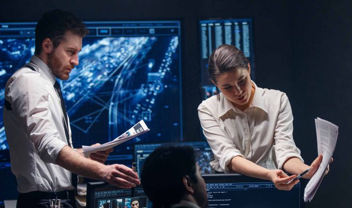 man and woman working on pc