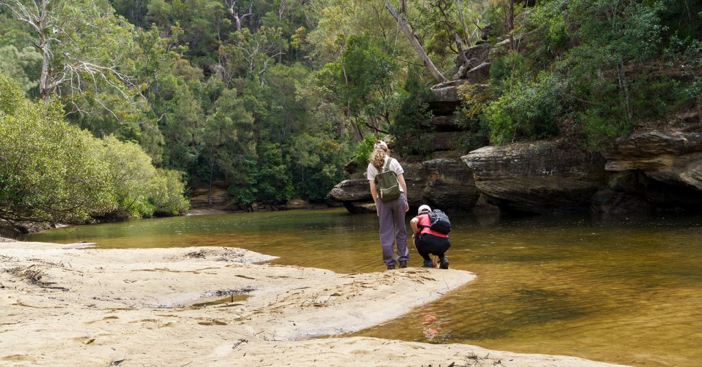 Two people near river